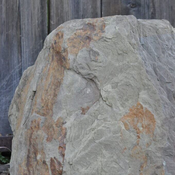 Close-up of a weathered rock surface with natural color variations.
